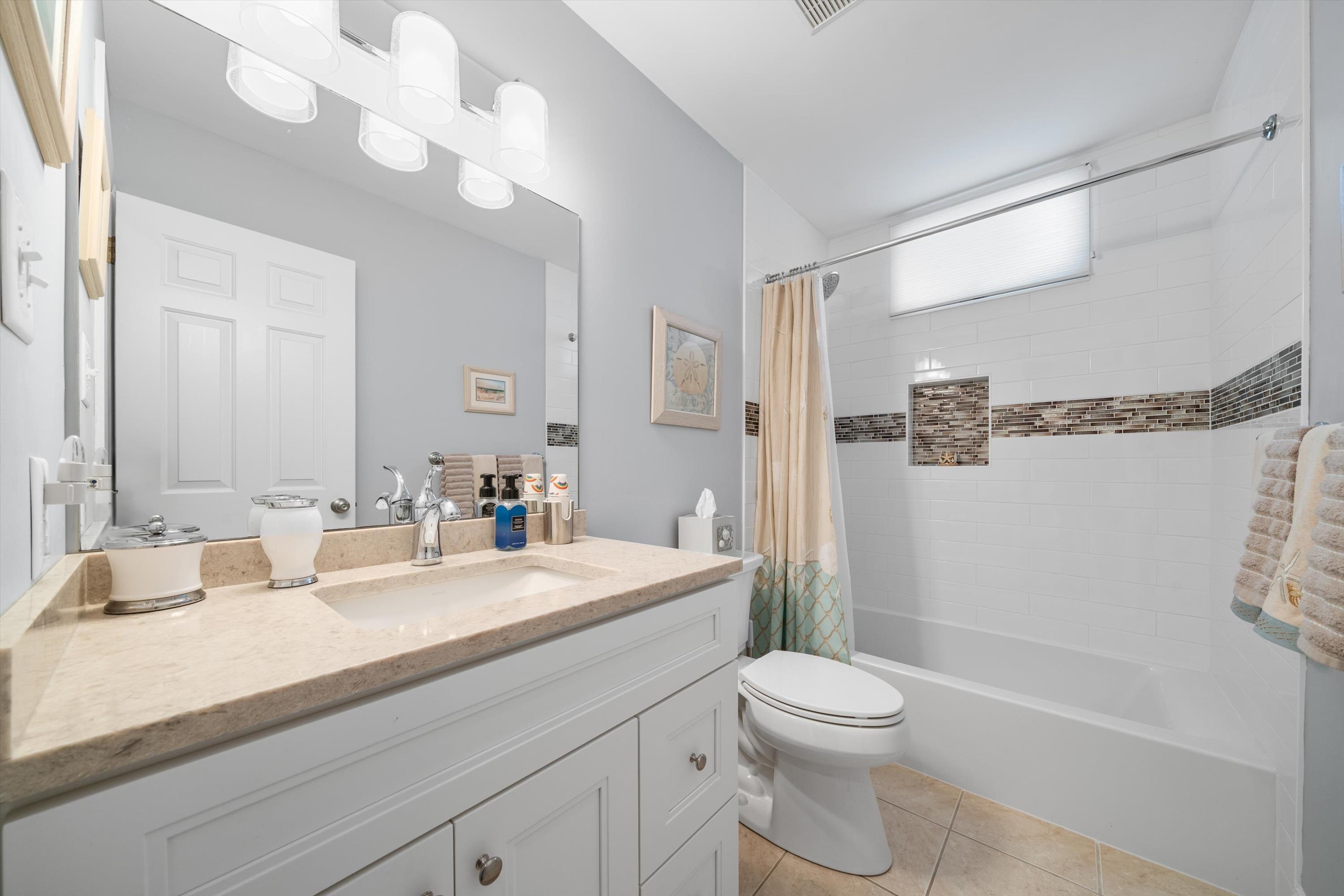 8222 3rd Avenue, Unit NORTH Stone Harbor, NJ 08247 - Photo 6 of 32 a bathroom with a sink a toilet and shower