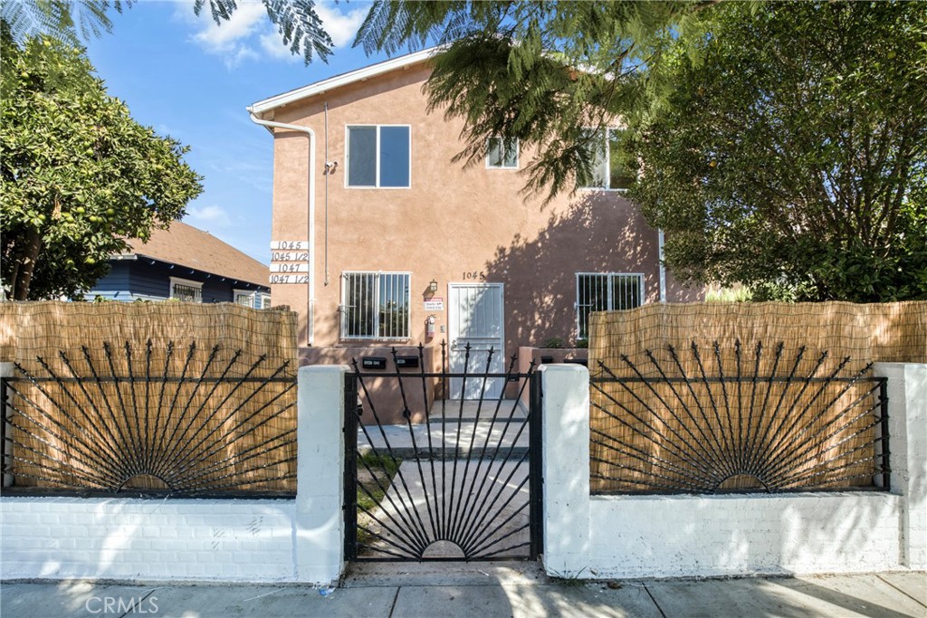 a view of a house with a iron gate
