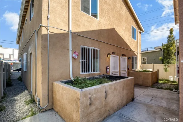 a view of a patio with table and chairs