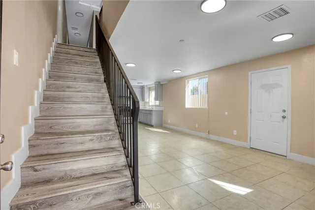 a kitchen with a sink stainless steel appliances and cabinets