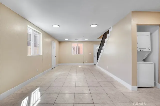an empty room with wooden floor and closet