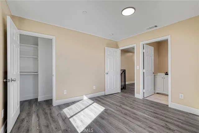 a bathroom with a sink toilet vanity and shower