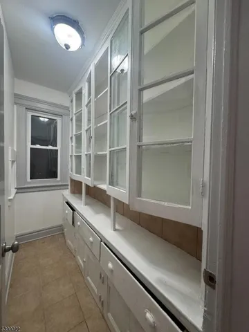 a kitchen with a sink and a cabinet