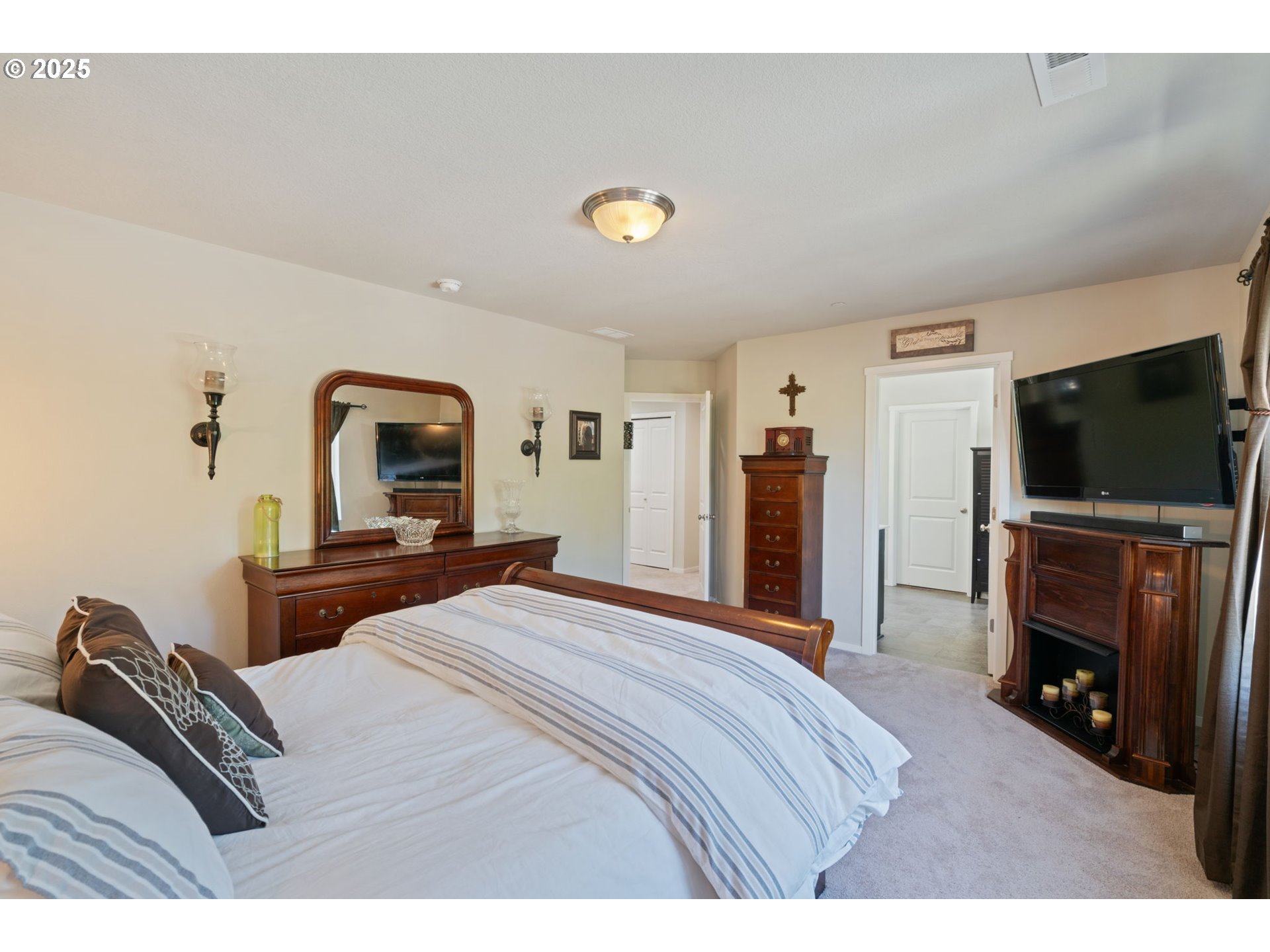 1707 Northeast 37th Avenue Camas, WA 98607 - Photo 24 of 44 a bedroom with a bed and a flat screen tv