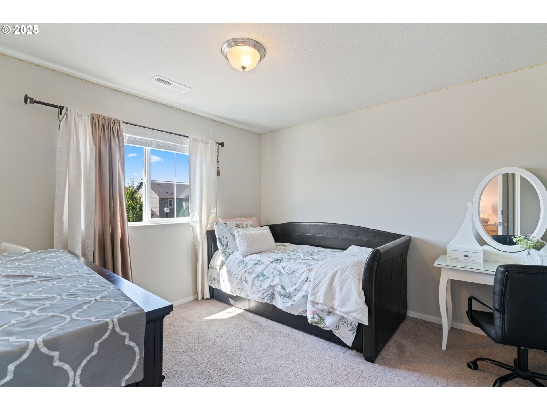 1707 Northeast 37th Avenue Camas, WA 98607 - Photo 29 of 44 a bedroom with a bed a table and chair