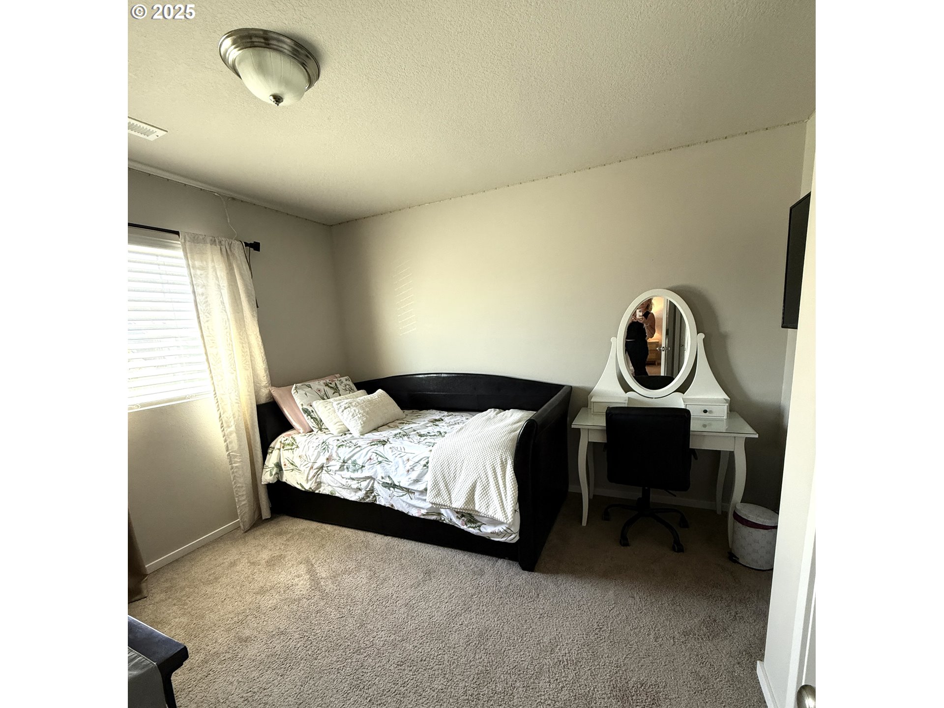 1707 Northeast 37th Avenue Camas, WA 98607 - Photo 6 of 44 a bed sitting in a bedroom next to a window