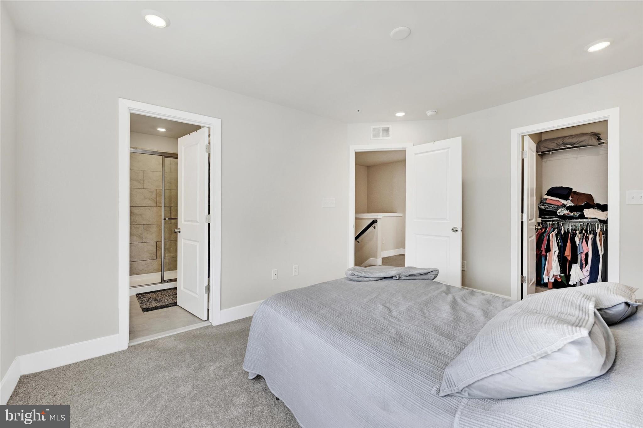 1819 Betterton Road Essex, MD 21221 - Photo 18 of 27 a bedroom with a bed and a walk in closet