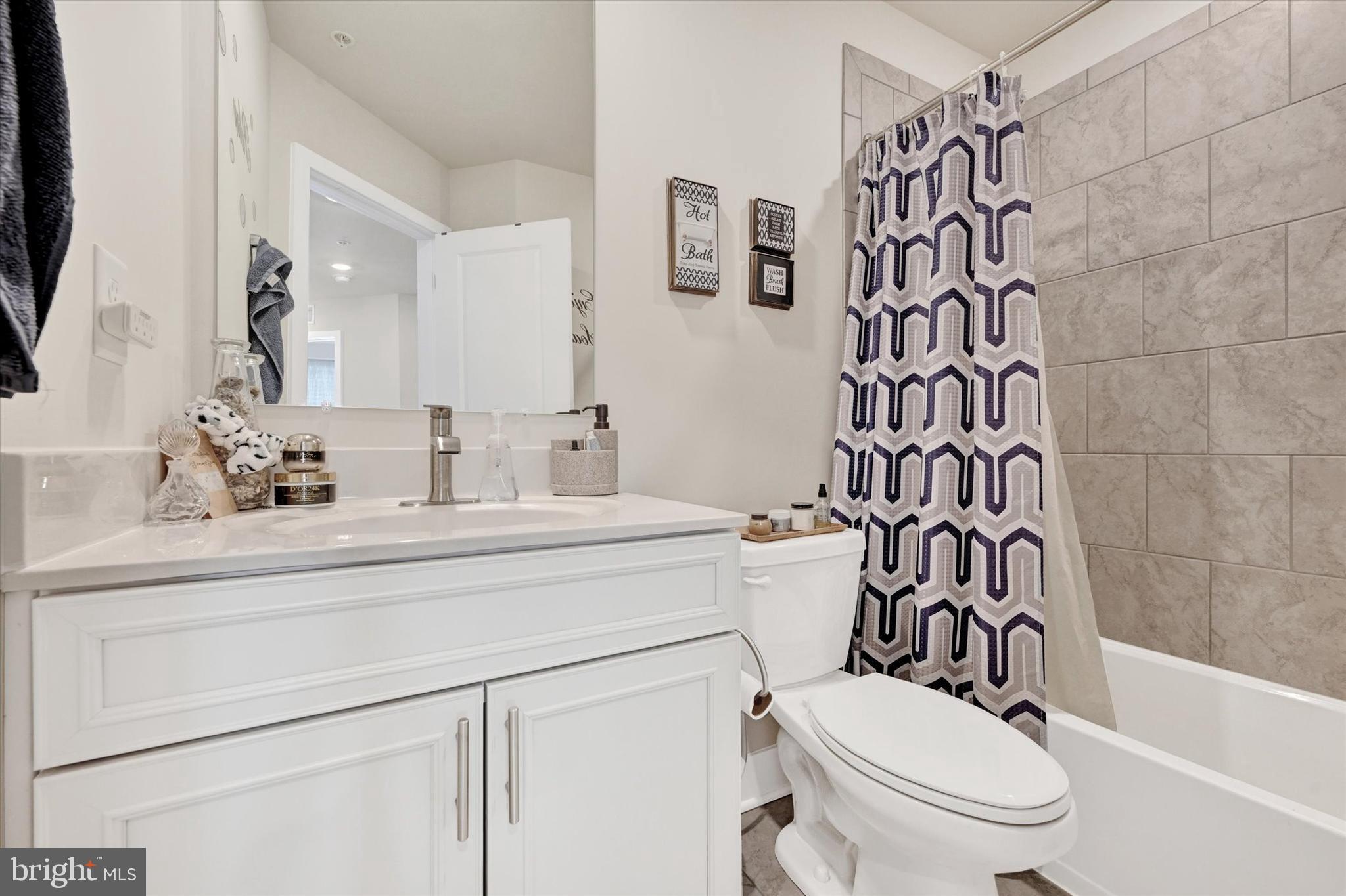 1819 Betterton Road Essex, MD 21221 - Photo 22 of 27 a bathroom with a toilet sink and a bathtub