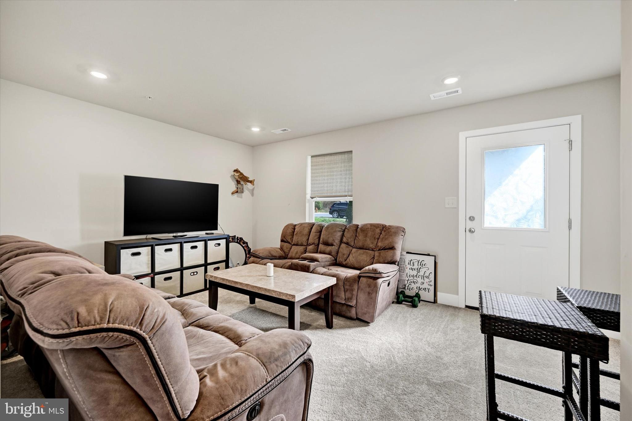 1819 Betterton Road Essex, MD 21221 - Photo 4 of 27 a living room with furniture and a flat screen tv