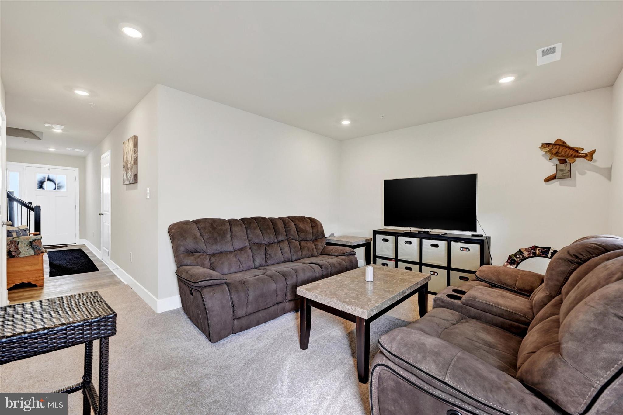 1819 Betterton Road Essex, MD 21221 - Photo 5 of 27 a living room with furniture and a flat screen tv
