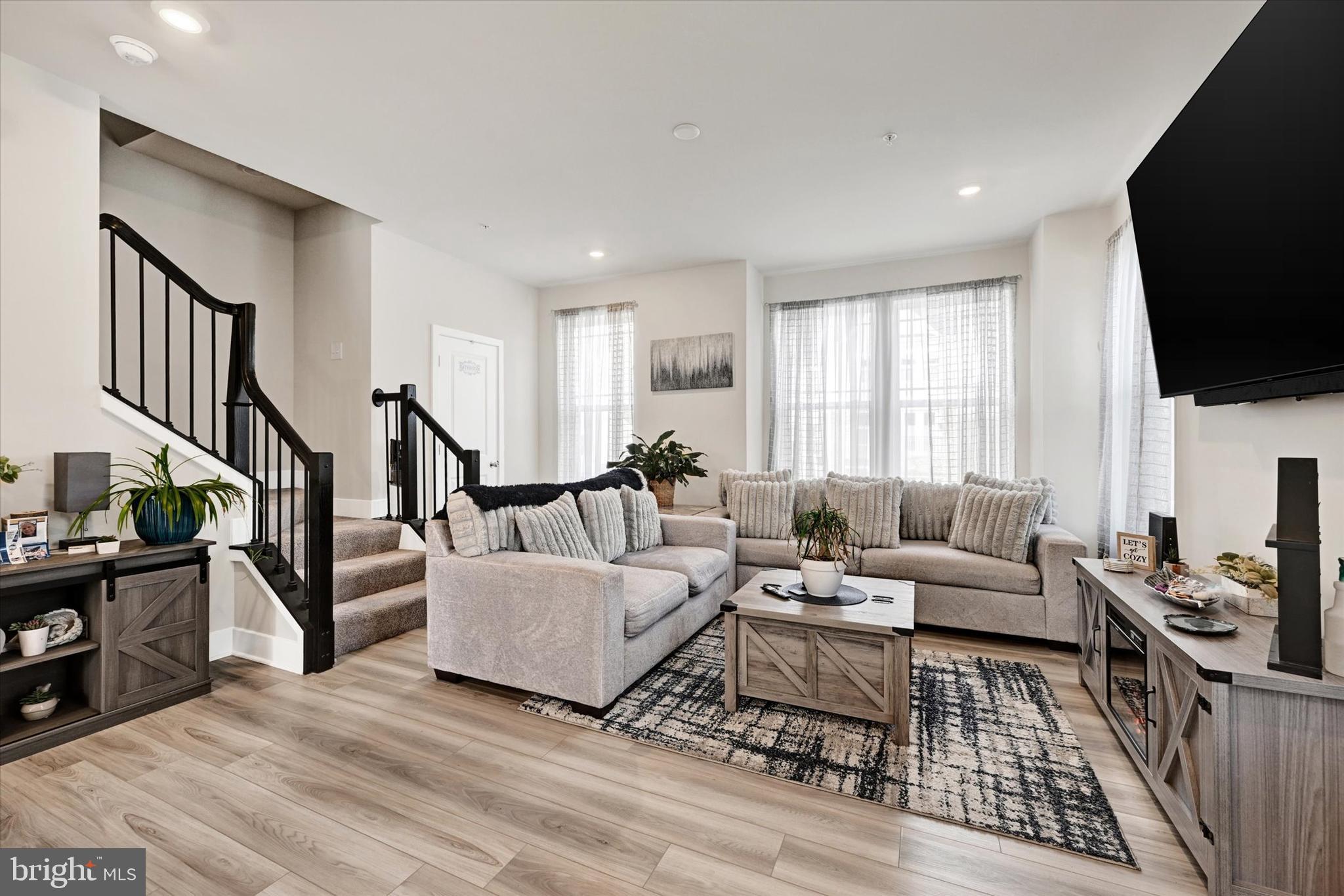 1819 Betterton Road Essex, MD 21221 - Photo 7 of 27 a living room with furniture a flat screen tv and a window