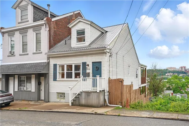 a front view of a house with garage
