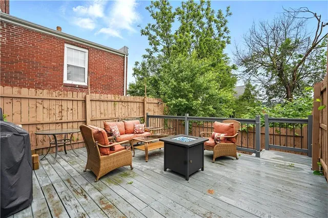 a outdoor living space with furniture and wooden floor