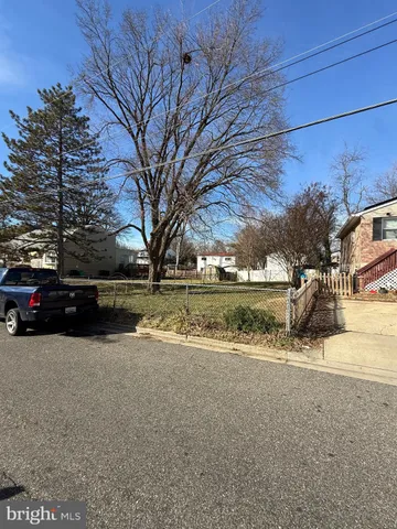 a view of street and parked cars