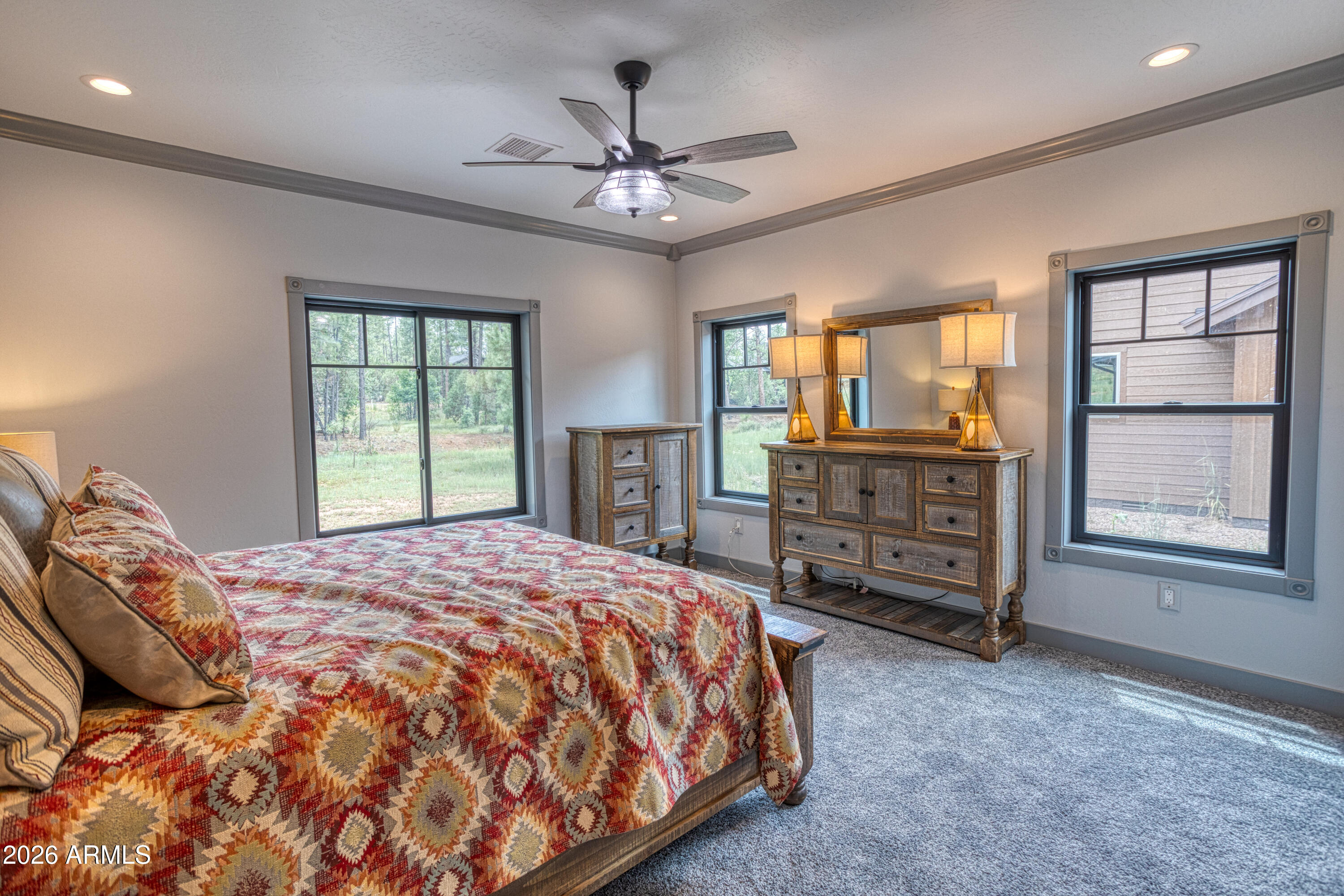 2281 West Edgewater Show Low, AZ 85901 - Photo 4 of 46 a spacious bedroom with a bed dresser and a window