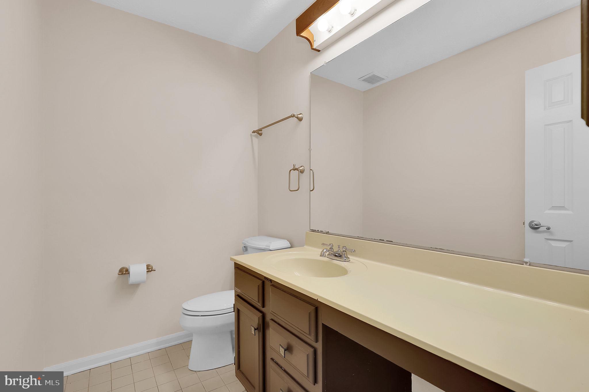 13404 Bregman Road Silver Spring, MD 20904 - Photo 29 of 53 a bathroom with a sink a toilet and a bathtub