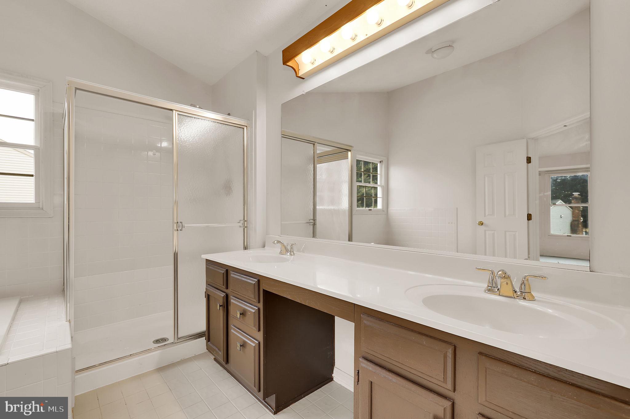 13404 Bregman Road Silver Spring, MD 20904 - Photo 36 of 53 a bathroom with a sink and a mirror