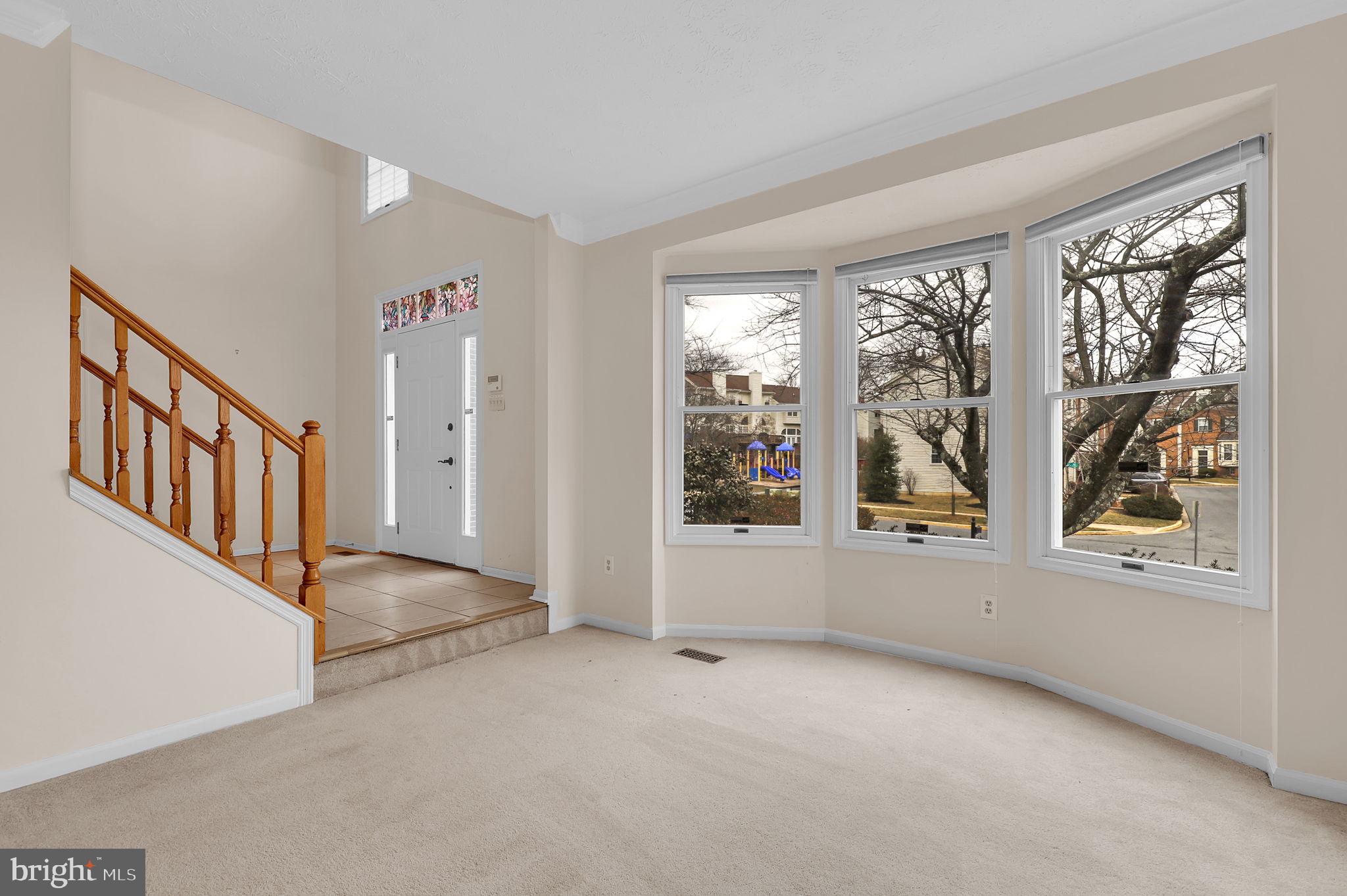 13404 Bregman Road Silver Spring, MD 20904 - Photo 8 of 53 an empty room with windows