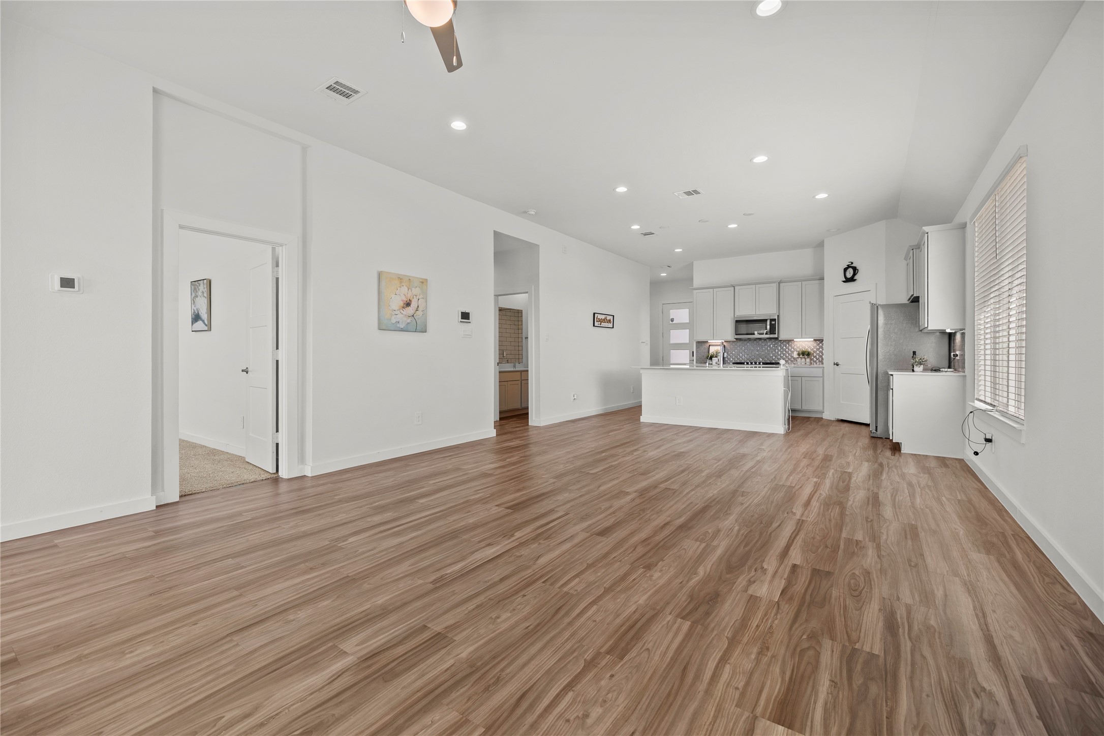 22803 Modica Rift Lane Katy, TX 77449 - Photo 12 of 30 a view of a kitchen with wooden floor
