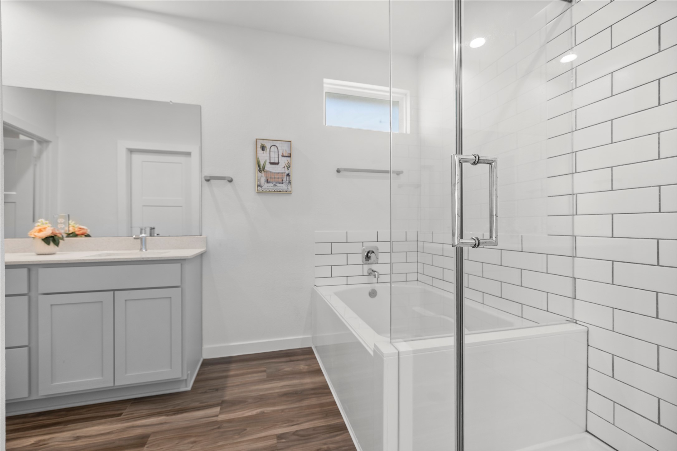 22803 Modica Rift Lane Katy, TX 77449 - Photo 21 of 30 a bathroom with a bathtub a sink a vanity and a shower