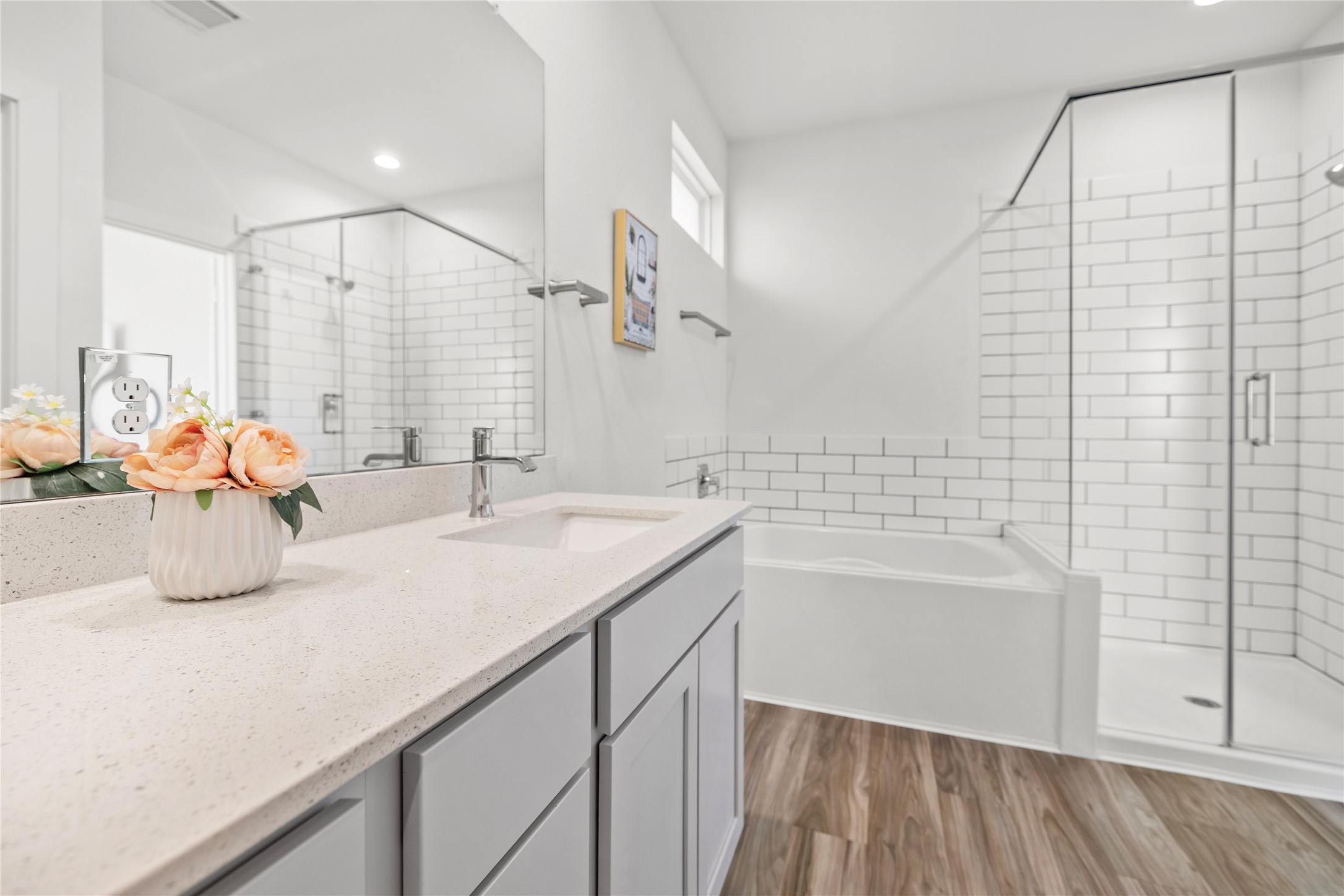 22803 Modica Rift Lane Katy, TX 77449 - Photo 23 of 30 a bathroom with a sink a tub and a mirror