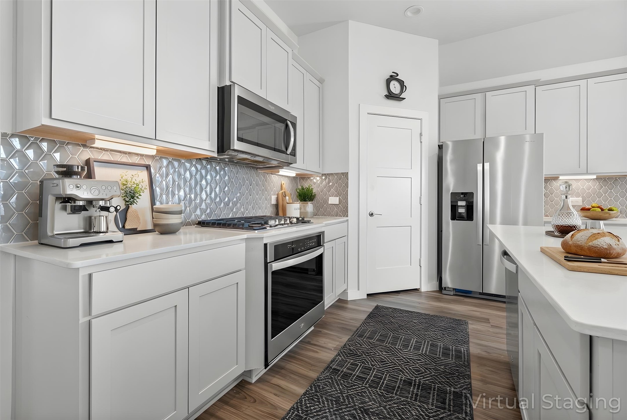 22803 Modica Rift Lane Katy, TX 77449 - Photo 3 of 30 a kitchen with white cabinets and stainless steel appliances