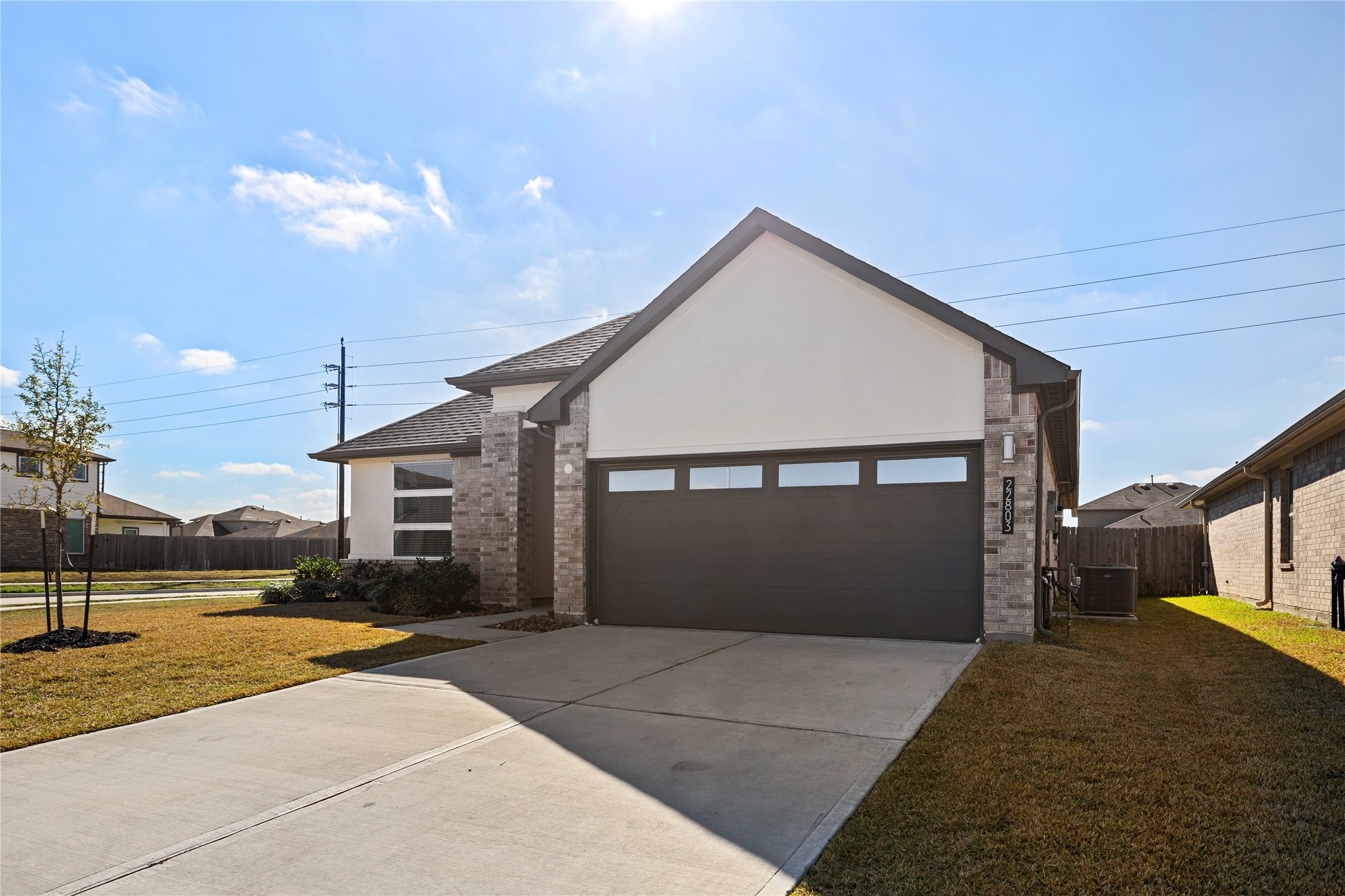 22803 Modica Rift Lane Katy, TX 77449 - Photo 7 of 30 a front view of a house with a yard and garage