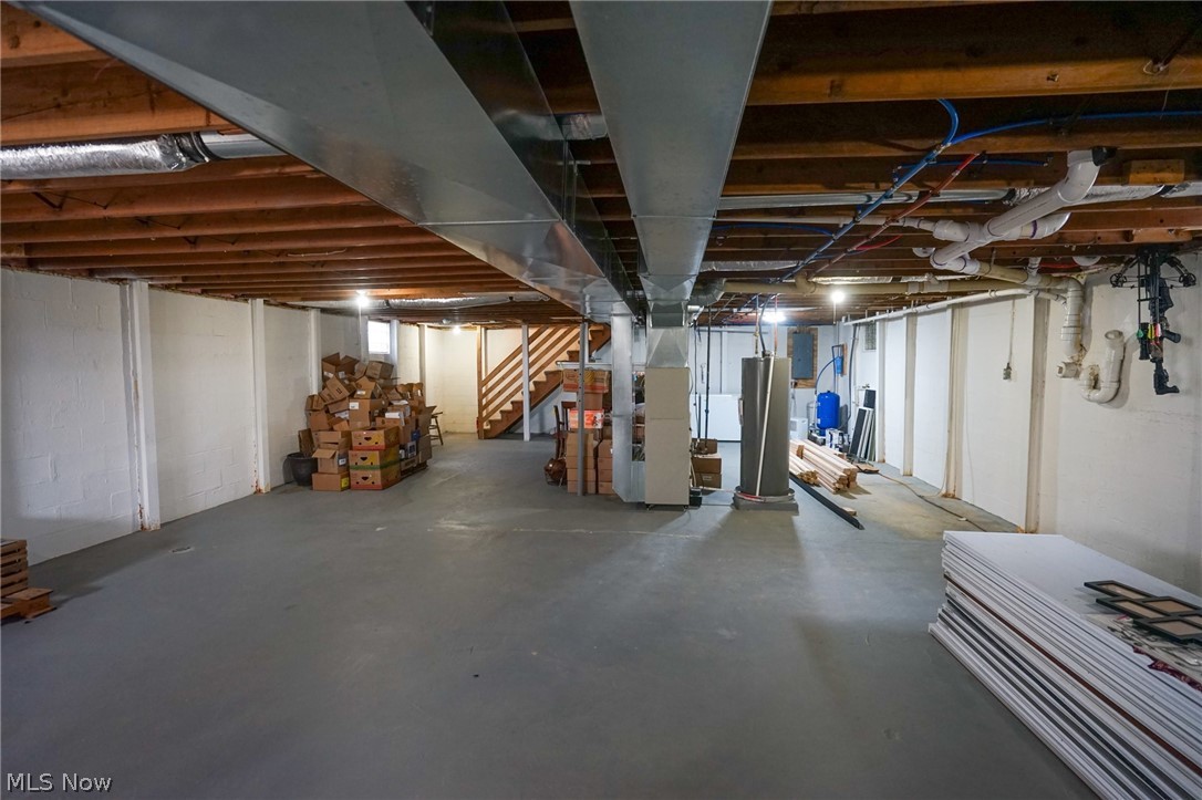 1325 County Line Road Hopewell, OH 43746 - Photo 24 of 45 Unfinished basement with heating unit, water heater, and a water pressure tank