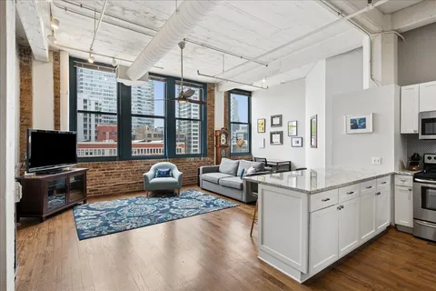 a large kitchen with sink stove and refrigerator