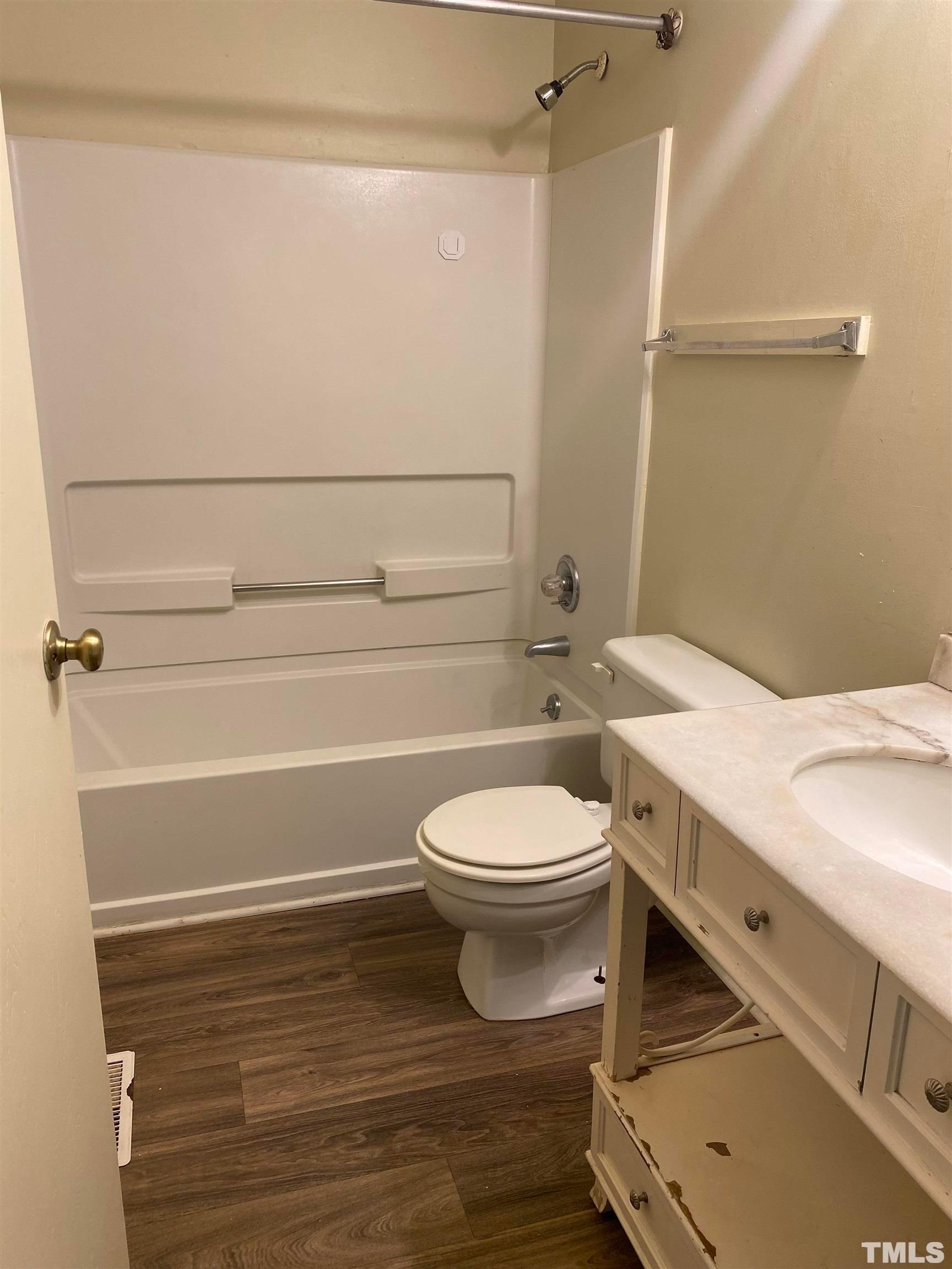 2801 Henslowe Drive Raleigh, NC 27603 - Photo 11 of 17 a bathroom with a toilet and a shower
