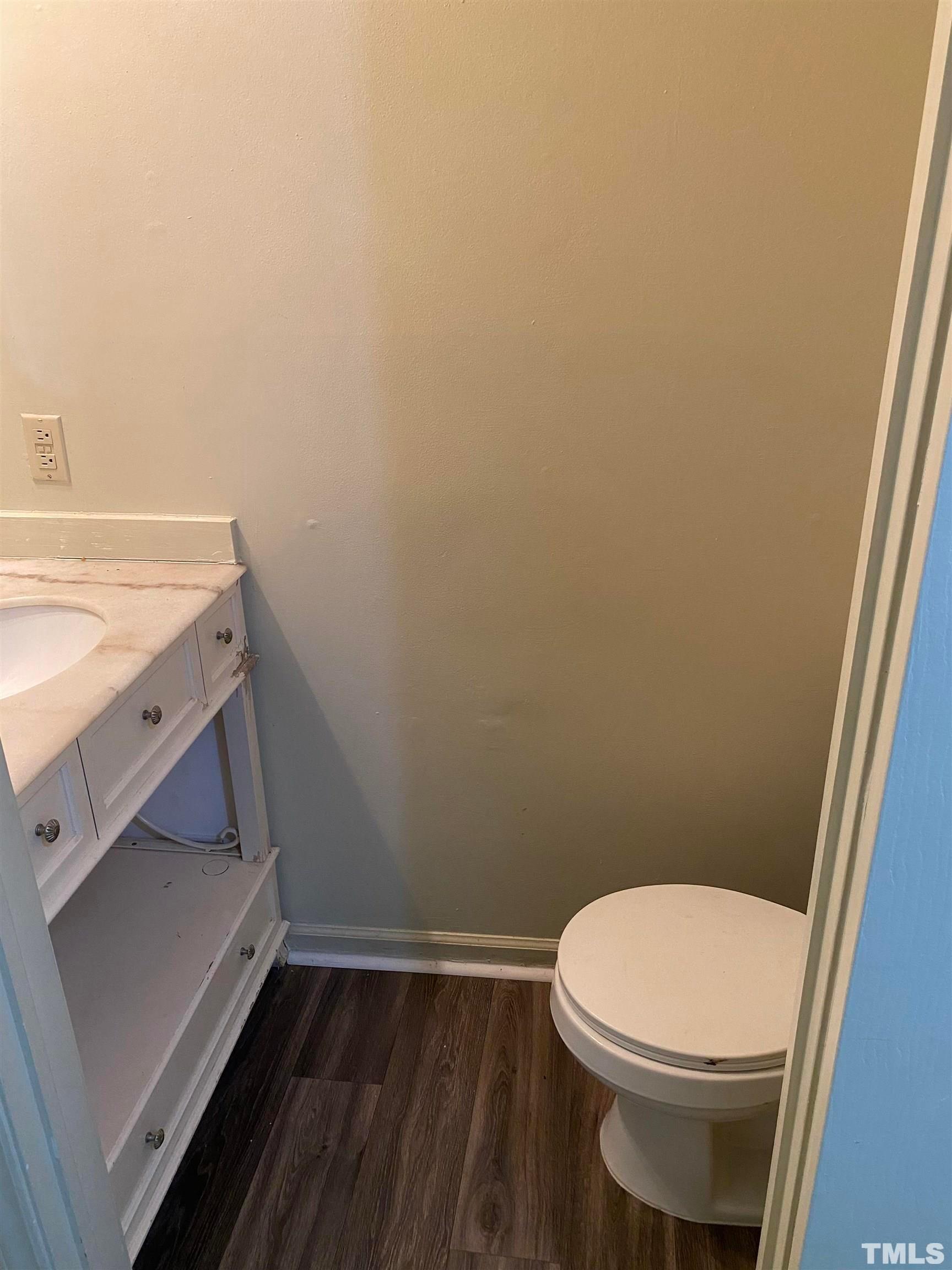 2801 Henslowe Drive Raleigh, NC 27603 - Photo 8 of 17 a bathroom with a toilet and a sink