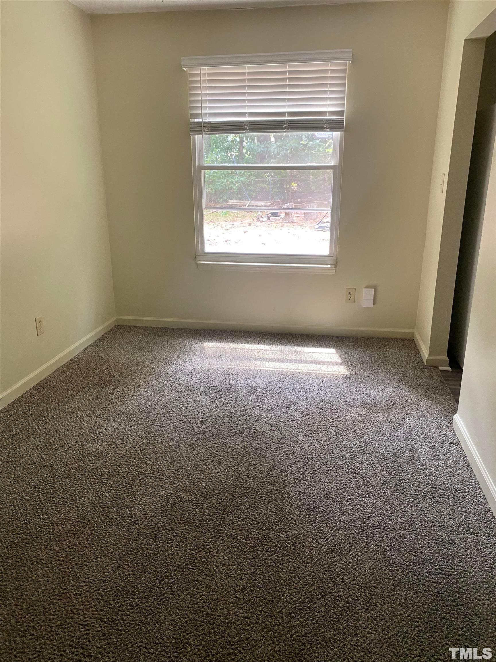 2801 Henslowe Drive Raleigh, NC 27603 - Photo 9 of 17 an empty room with a window