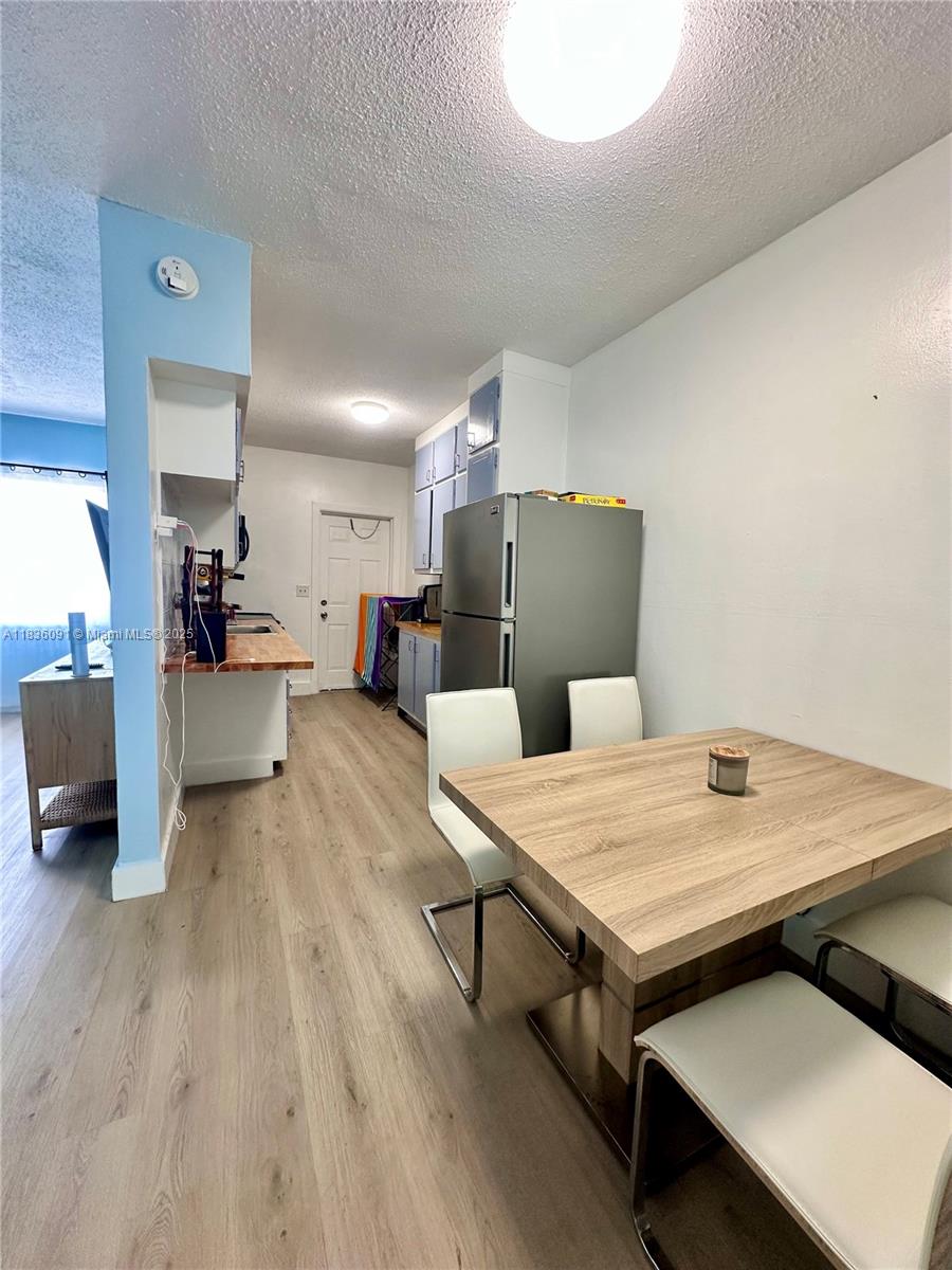 2200 South Ocean Drive, Unit N110 Hollywood, FL 33019 - Photo 11 of 21 a living room with a table and chairs