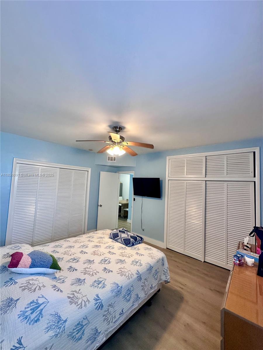 2200 South Ocean Drive, Unit N110 Hollywood, FL 33019 - Photo 14 of 21 a bedroom with a bed and a chandelier