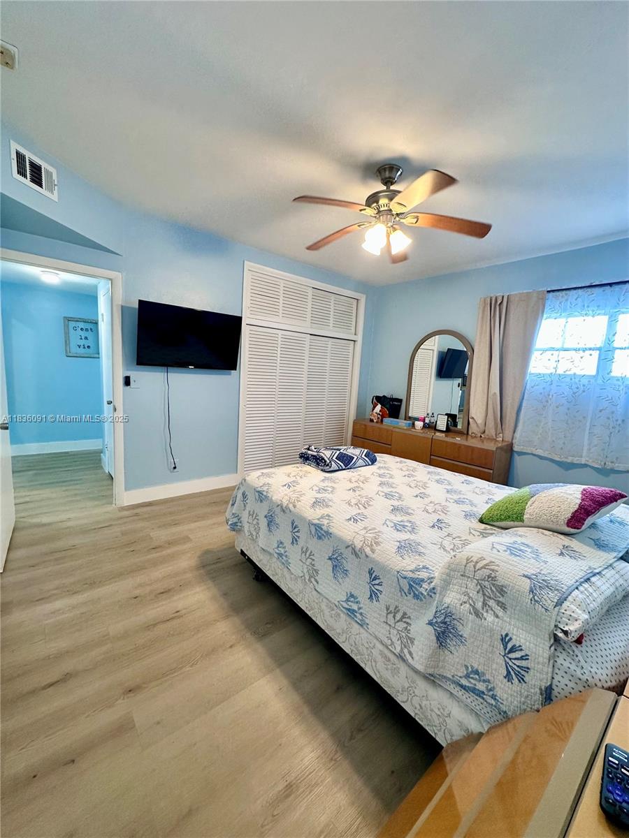 2200 South Ocean Drive, Unit N110 Hollywood, FL 33019 - Photo 15 of 21 a bedroom with a bed and a chandelier