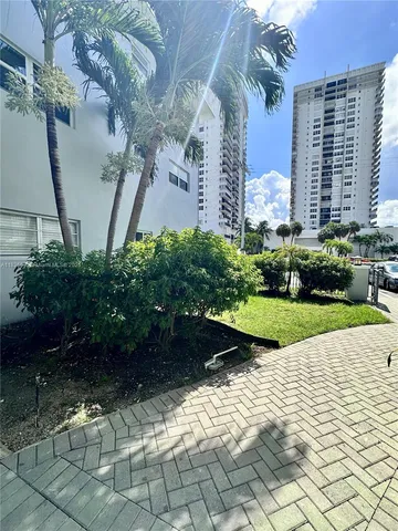 a view of a garden with potted plants