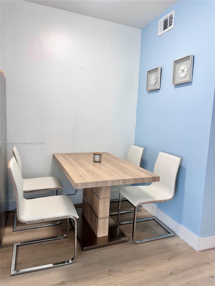 2200 South Ocean Drive, Unit N110 Hollywood, FL 33019 - Photo 7 of 21 a view of a room with furniture and wooden floor