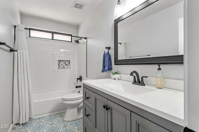 a outdoor space with chairs and a fireplace