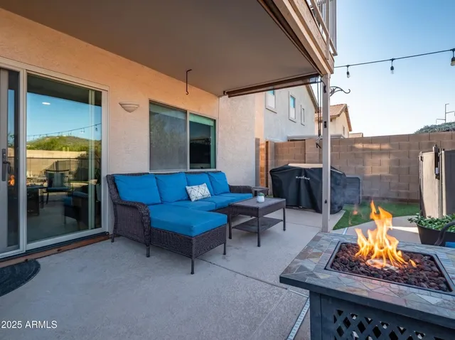 a view of a swimming pool and sitting area