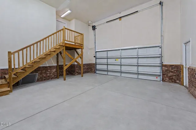 a view of an empty room and stairs