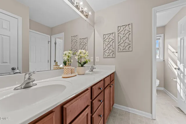 a bathroom with a sink a vanity and a mirror