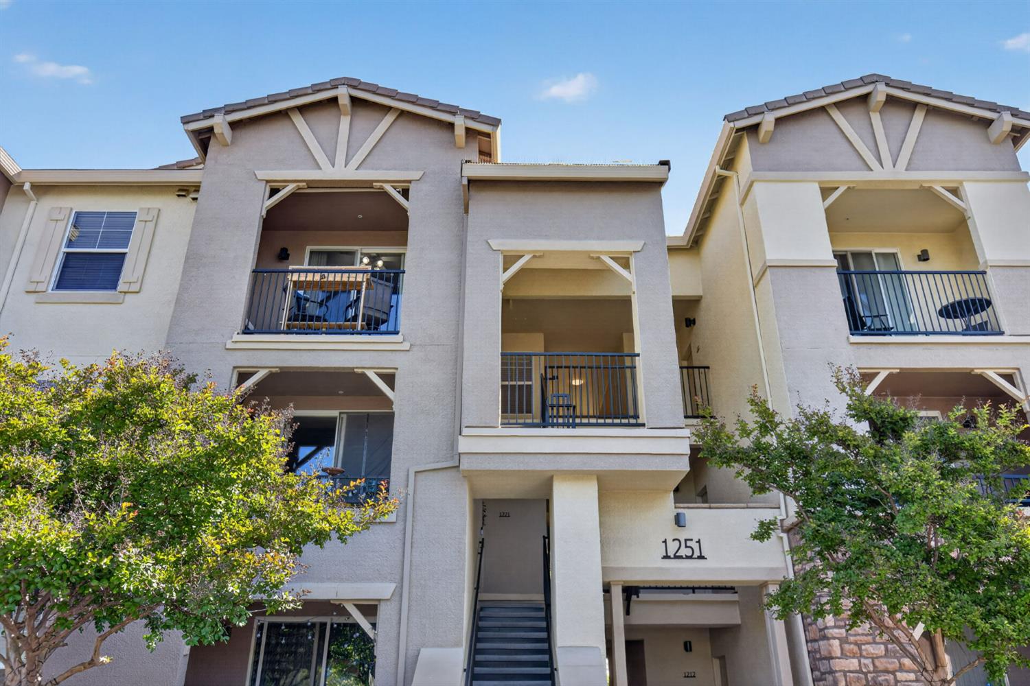 1251 Whitney Ranch Parkway, Unit 1231 Rocklin, CA 95765 - Photo 1 of 44 a front view of a house with a yard