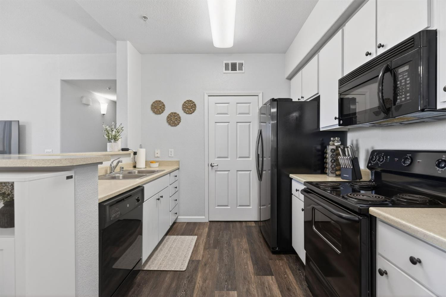 1251 Whitney Ranch Parkway, Unit 1231 Rocklin, CA 95765 - Photo 12 of 44 a kitchen with a sink stove and refrigerator