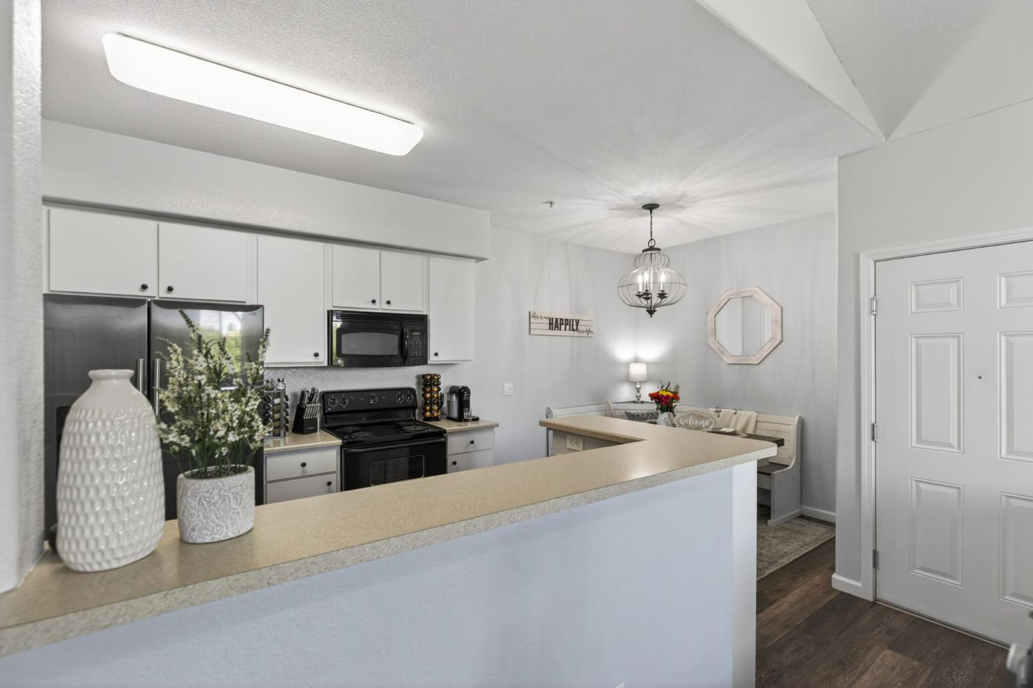 1251 Whitney Ranch Parkway, Unit 1231 Rocklin, CA 95765 - Photo 16 of 44 a kitchen with sink a microwave and refrigerator