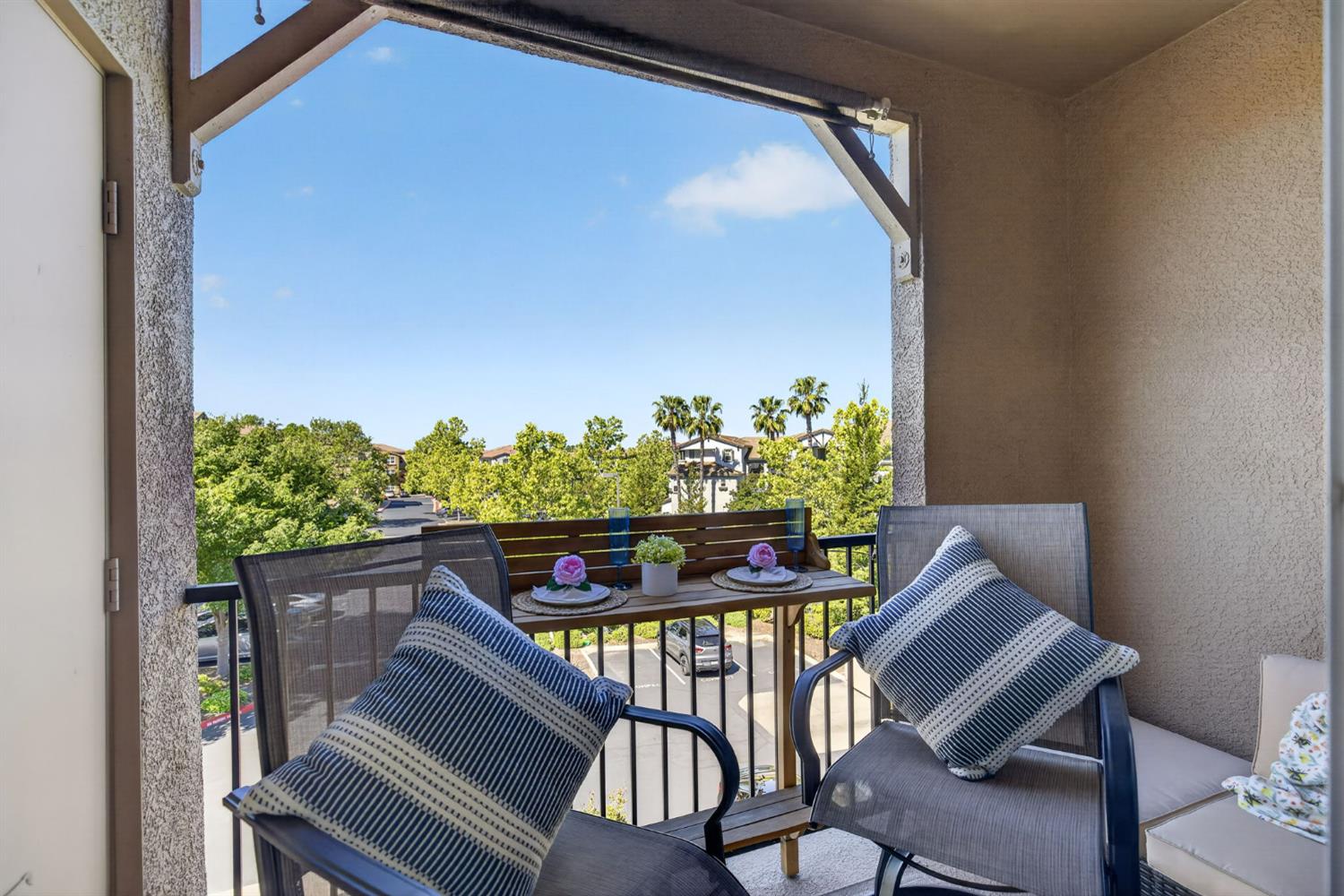1251 Whitney Ranch Parkway, Unit 1231 Rocklin, CA 95765 - Photo 19 of 44 a view of balcony with wooden floor and a potted plant