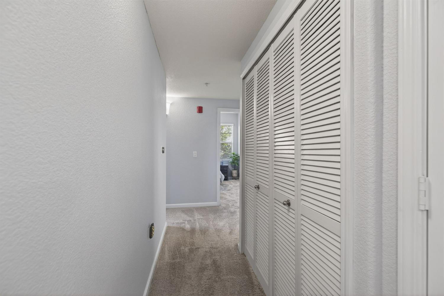 1251 Whitney Ranch Parkway, Unit 1231 Rocklin, CA 95765 - Photo 20 of 44 a view of a hallway with wooden floor