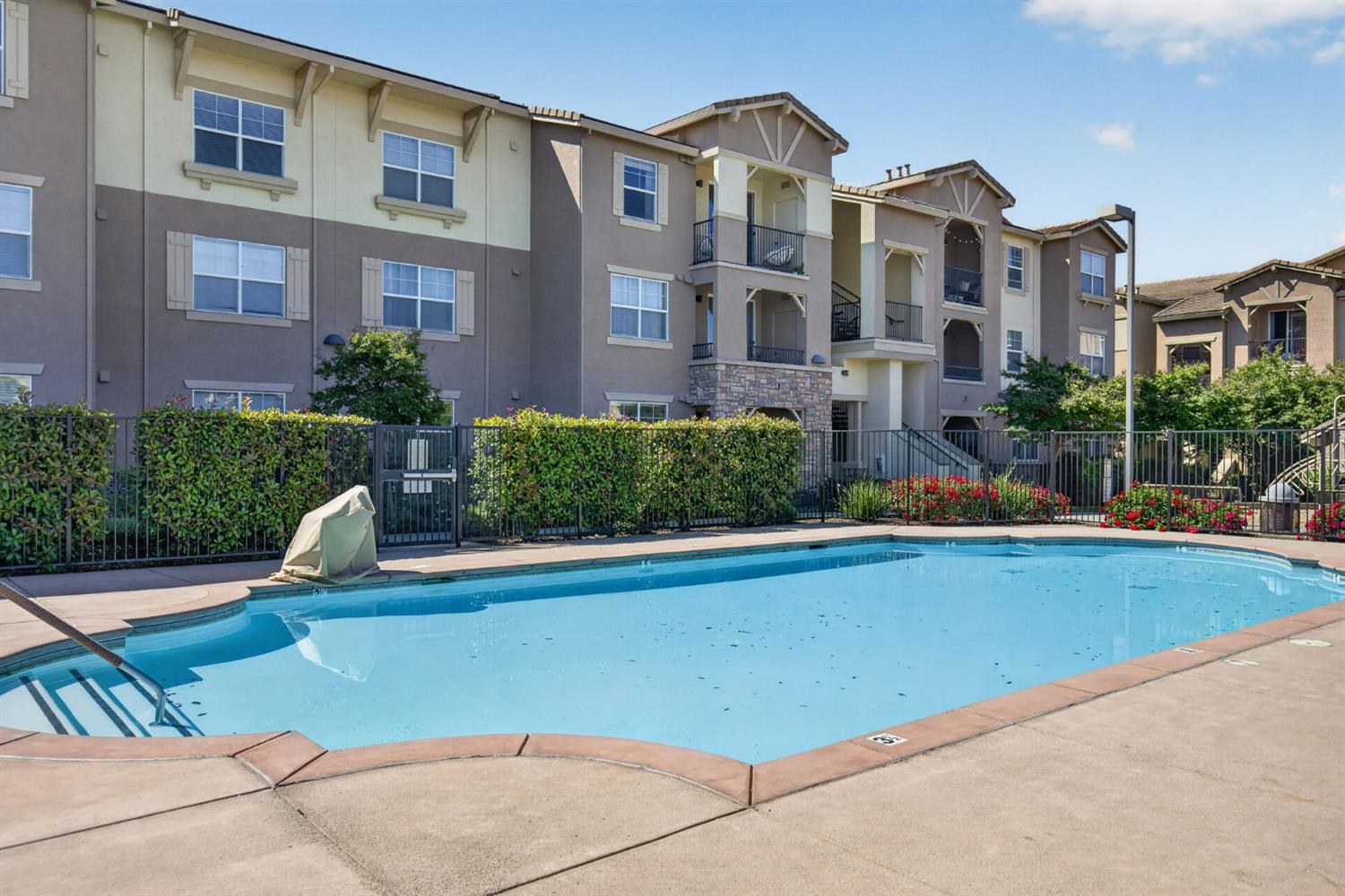 1251 Whitney Ranch Parkway, Unit 1231 Rocklin, CA 95765 - Photo 33 of 44 a front view of a house with swimming pool and glass windows