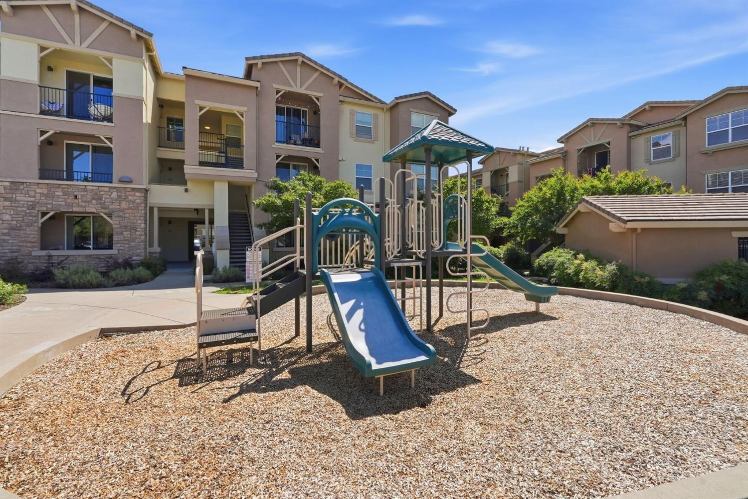 1251 Whitney Ranch Parkway, Unit 1231 Rocklin, CA 95765 - Photo 37 of 44 a view of a house with a park