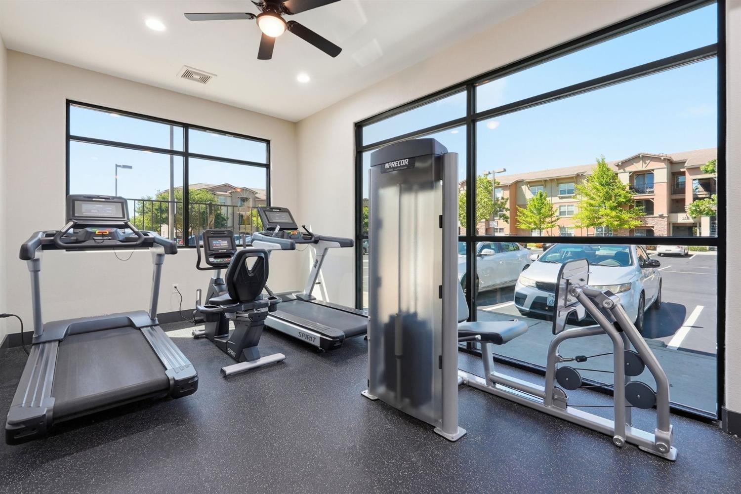 1251 Whitney Ranch Parkway, Unit 1231 Rocklin, CA 95765 - Photo 39 of 44 a room with gym equipment and a large window
