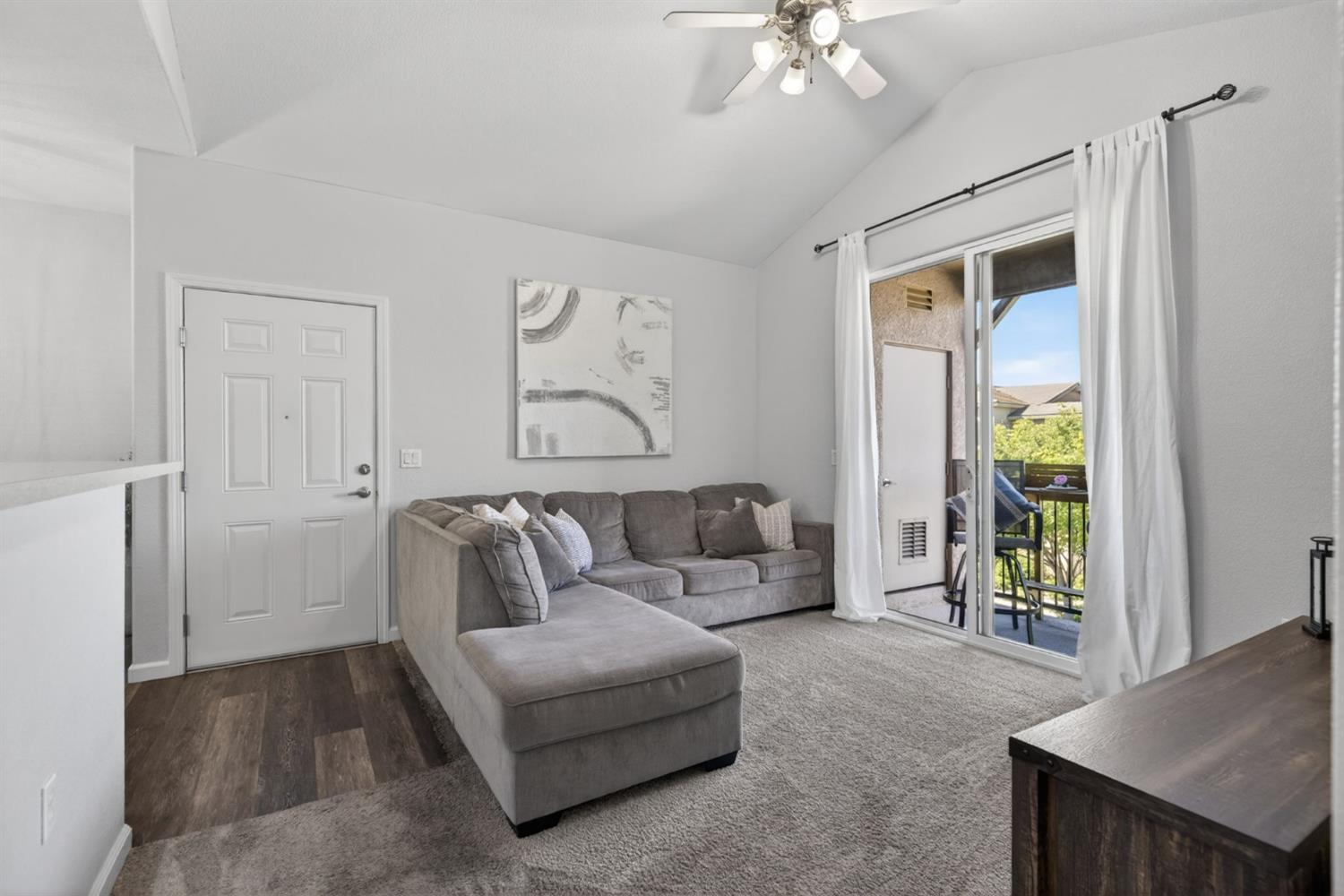 1251 Whitney Ranch Parkway, Unit 1231 Rocklin, CA 95765 - Photo 9 of 44 a living room with furniture and a chandelier